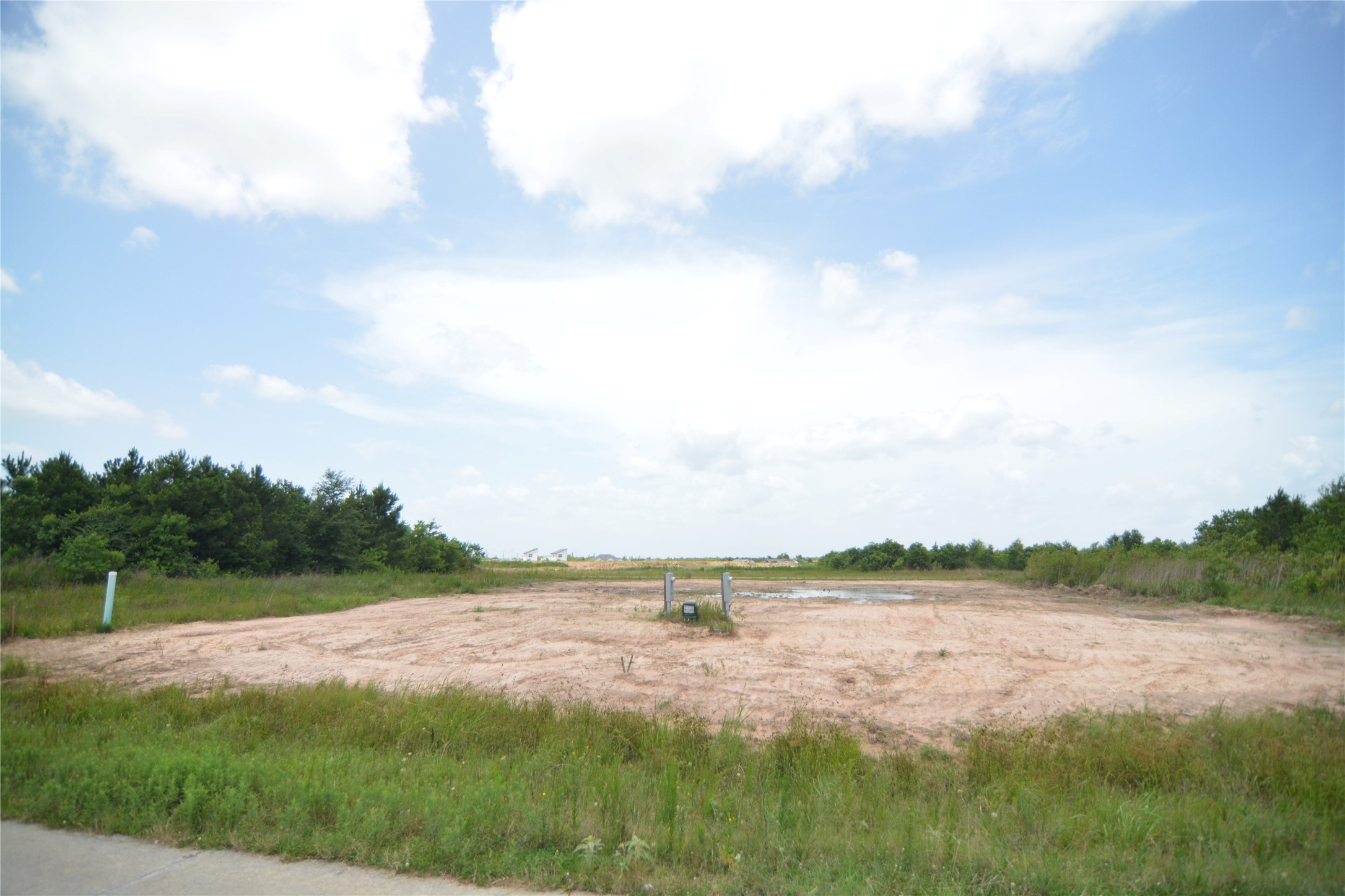 7715 Amanda Road Cleveland, TX 77327 - Photo 2 of 16 a view of a lake from a yard
