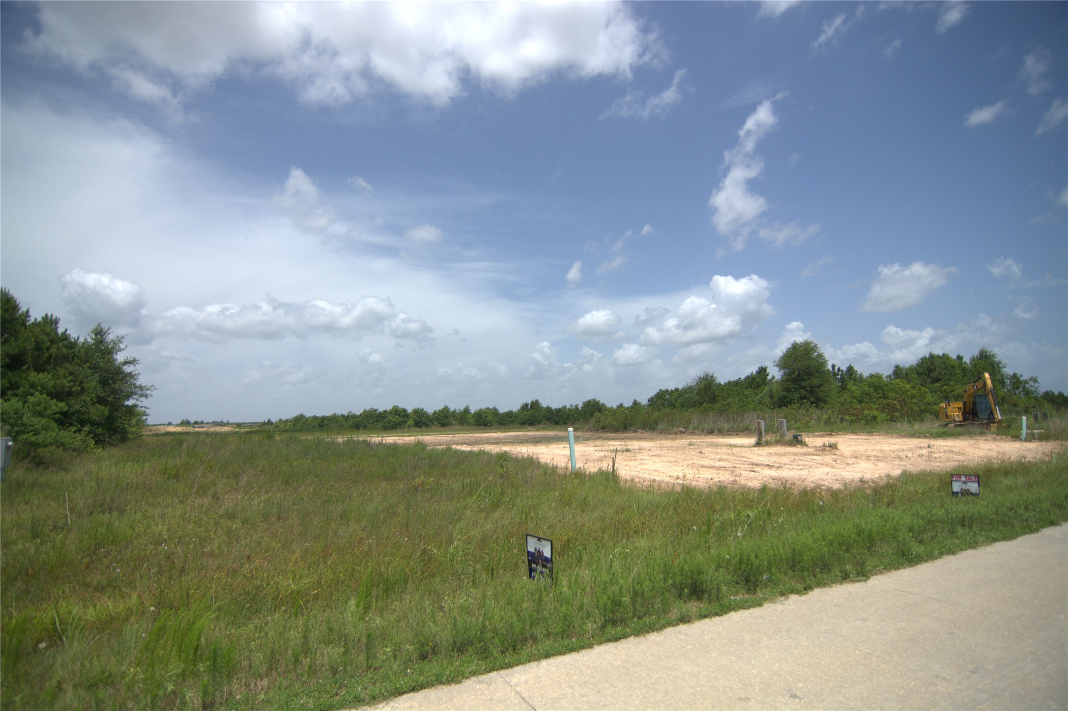 7715 Amanda Road Cleveland, TX 77327 - Photo 4 of 16 a view of a lake with a big yard