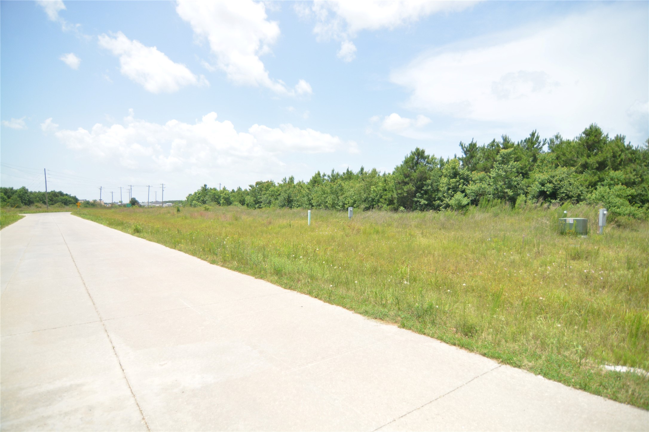 7715 Amanda Road Cleveland, TX 77327 - Photo 8 of 16 a view of a lake with a big yard