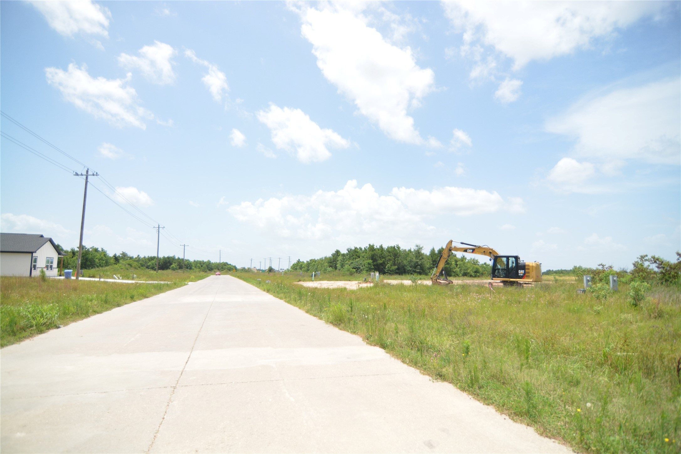 7715 Amanda Road Cleveland, TX 77327 - Photo 9 of 16 a view of a lake with a big yard
