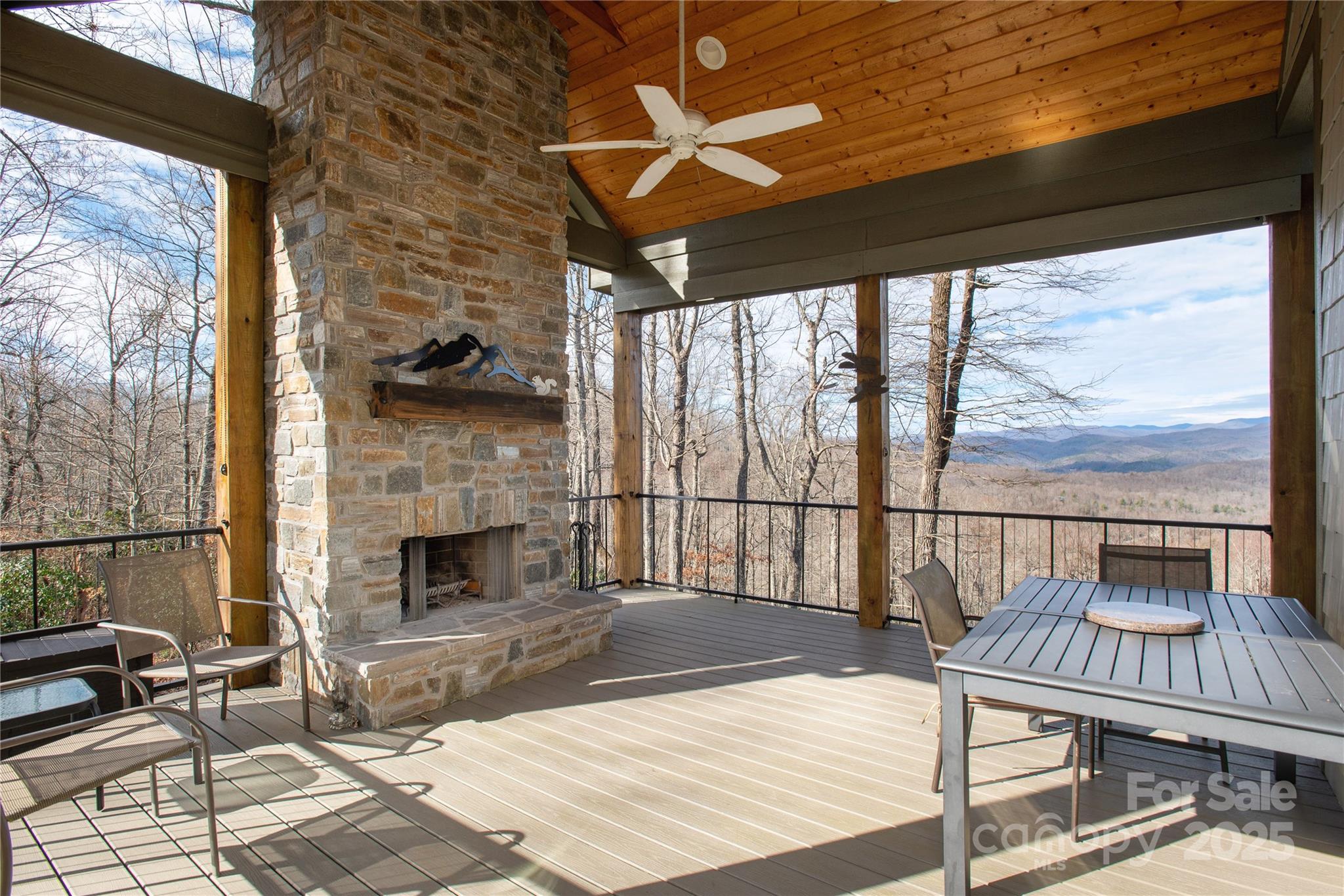 69 Pepperbush Road Brevard, NC 28712 - Photo 11 of 34 a living room with furniture a fireplace and a table