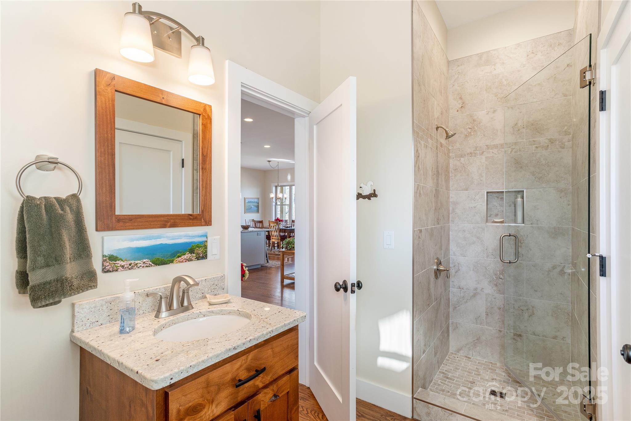 69 Pepperbush Road Brevard, NC 28712 - Photo 17 of 34 a bathroom with a sink vanity granite shower and a mirror