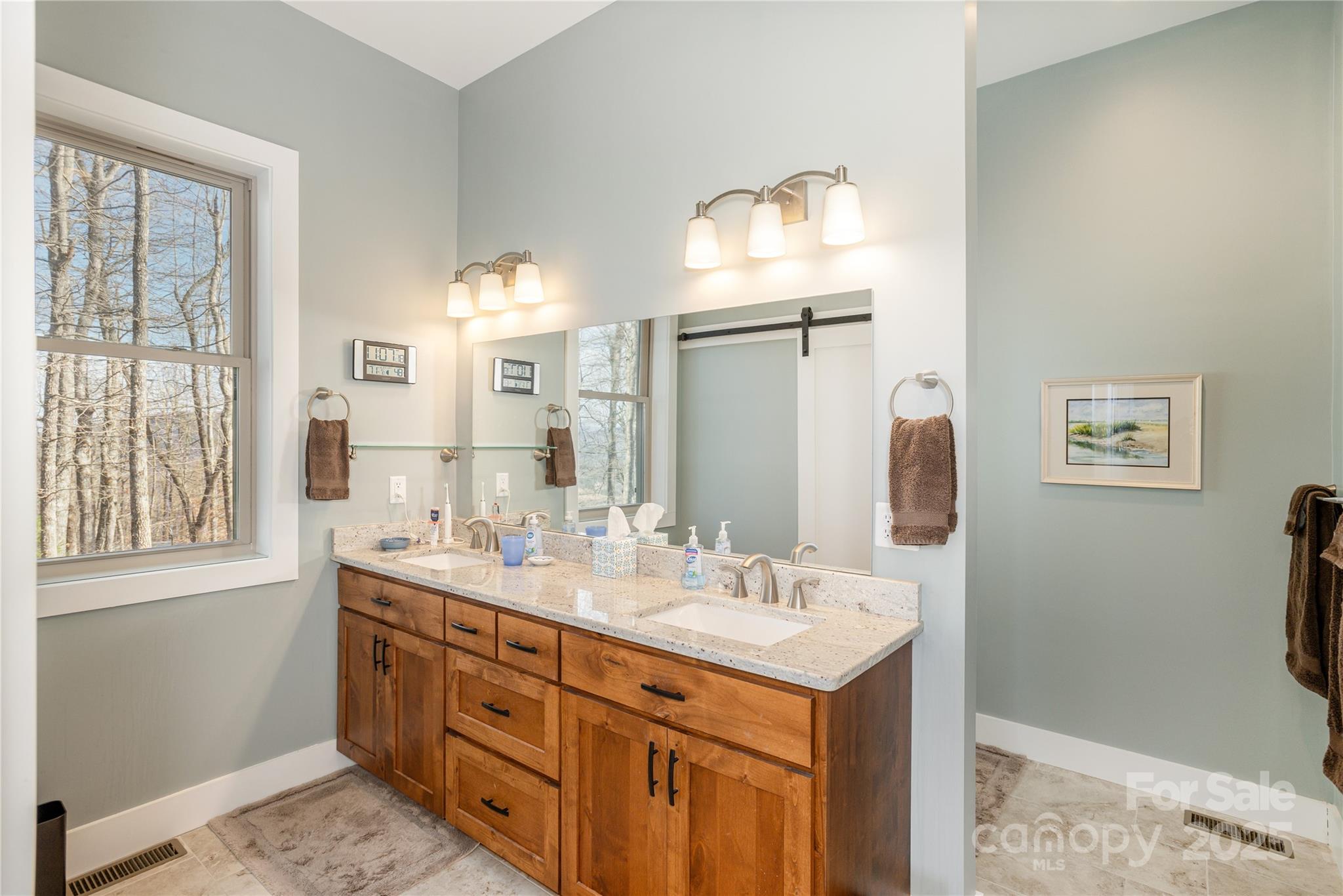 69 Pepperbush Road Brevard, NC 28712 - Photo 20 of 34 a bathroom with double sink and a mirror