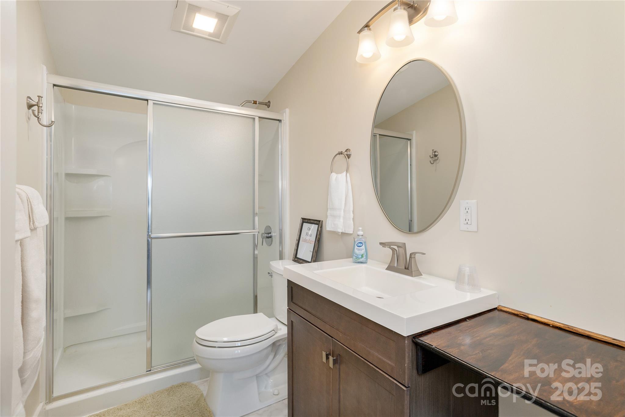 69 Pepperbush Road Brevard, NC 28712 - Photo 23 of 34 a bathroom with a sink toilet and shower