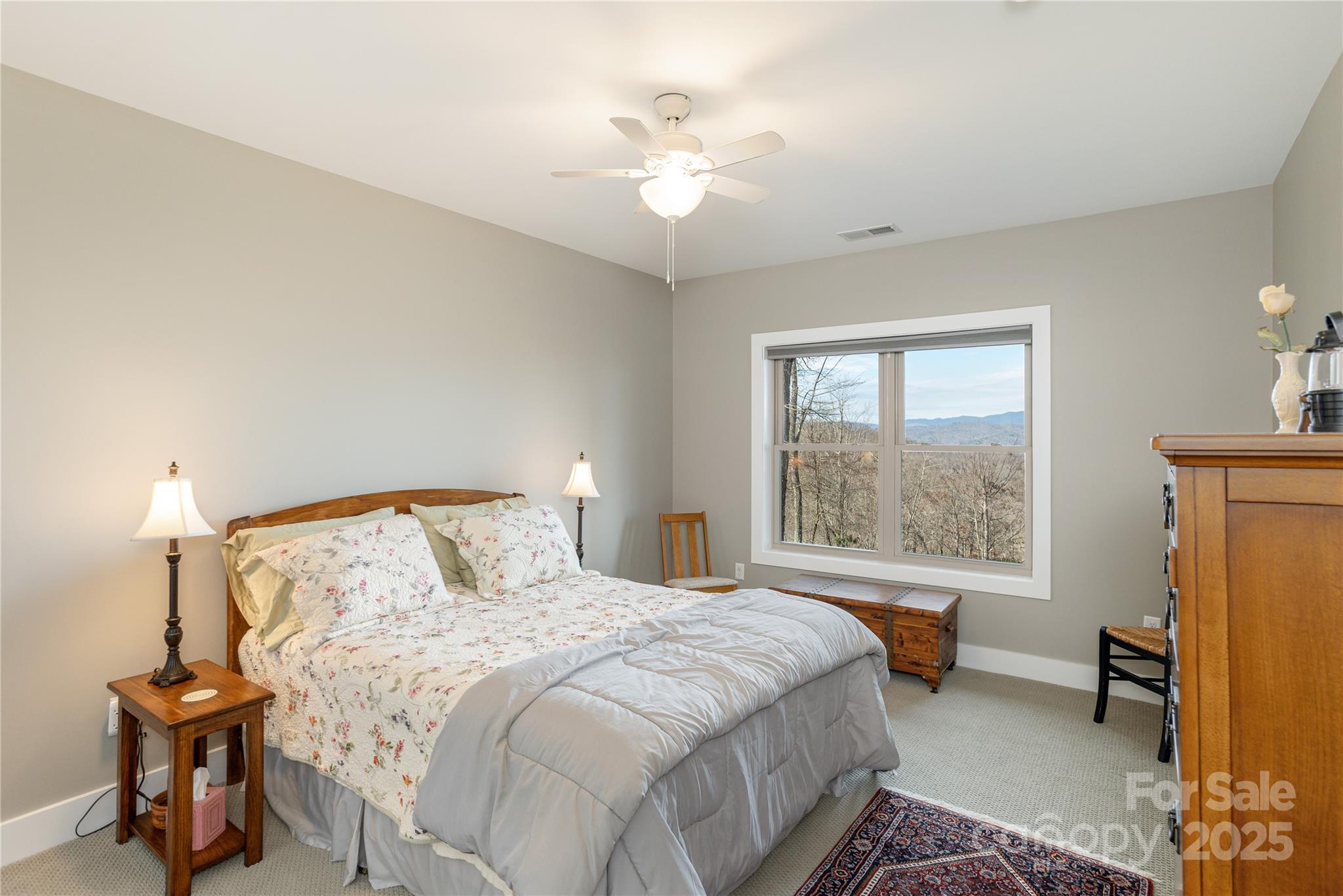69 Pepperbush Road Brevard, NC 28712 - Photo 24 of 34 a bedroom with a bed and a table lamp