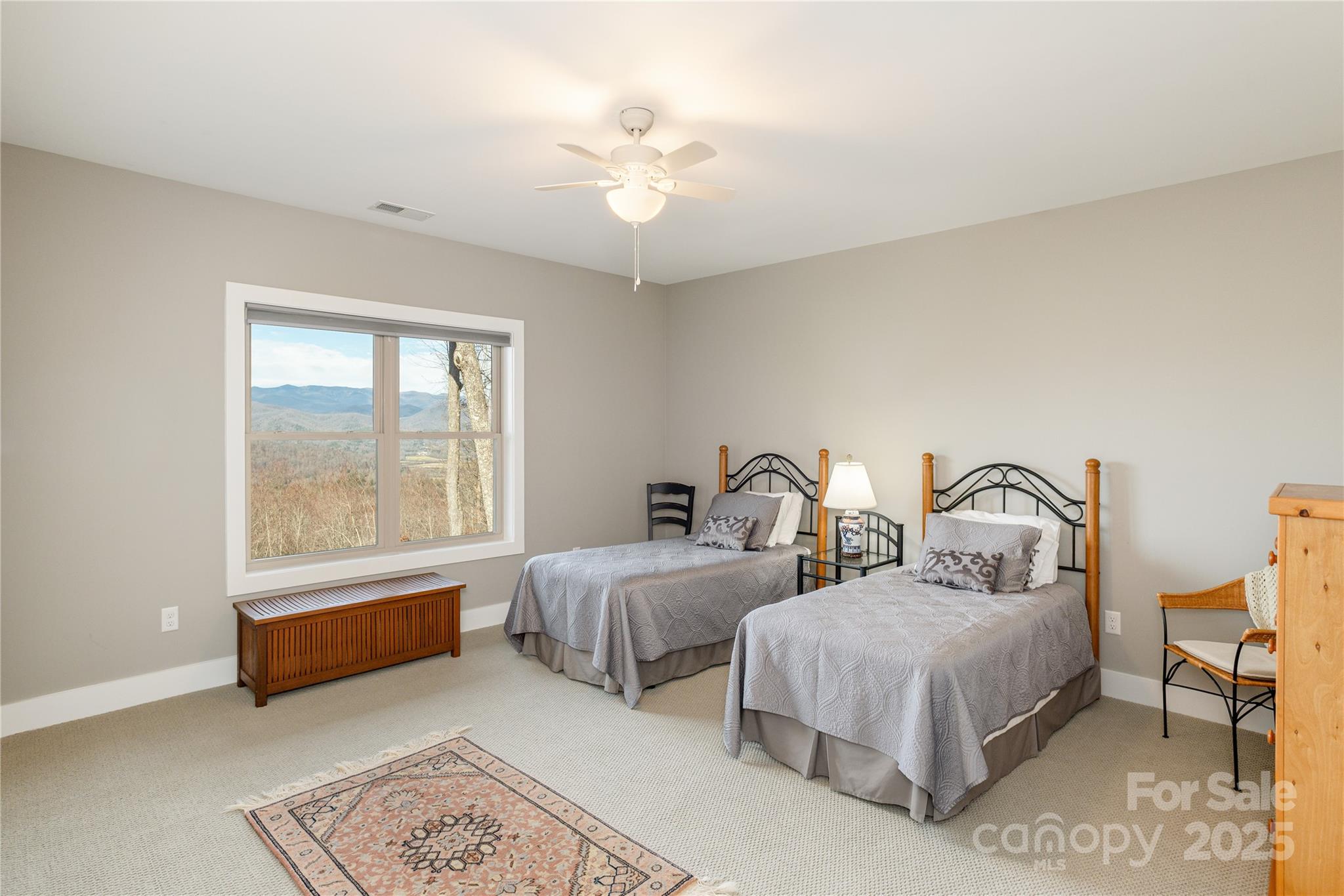 69 Pepperbush Road Brevard, NC 28712 - Photo 26 of 34 a bedroom with two beds and a large window