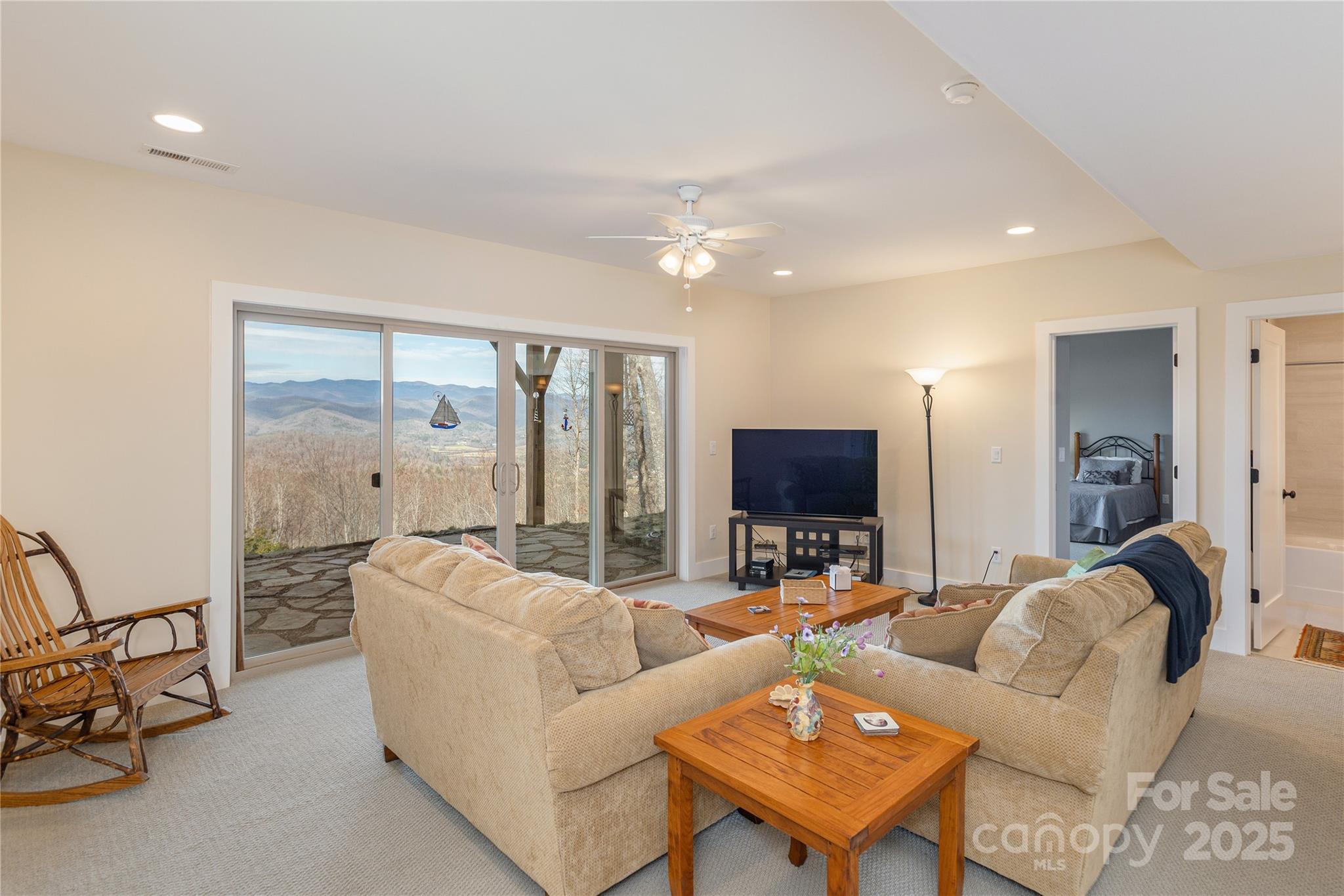 69 Pepperbush Road Brevard, NC 28712 - Photo 28 of 34 a living room with furniture and a flat screen tv
