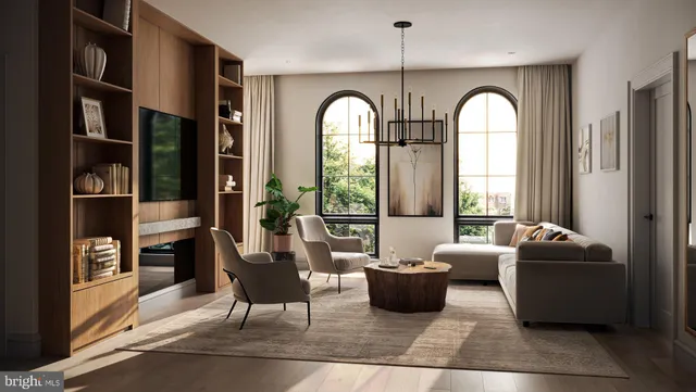 a living room with furniture fireplace and rug