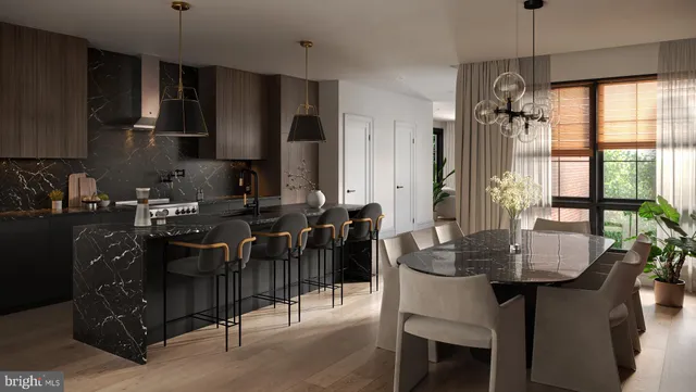 a kitchen with granite countertop a sink dining table and chairs