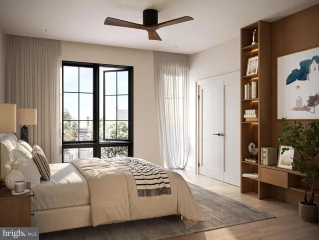 a bedroom with a bed and a couch