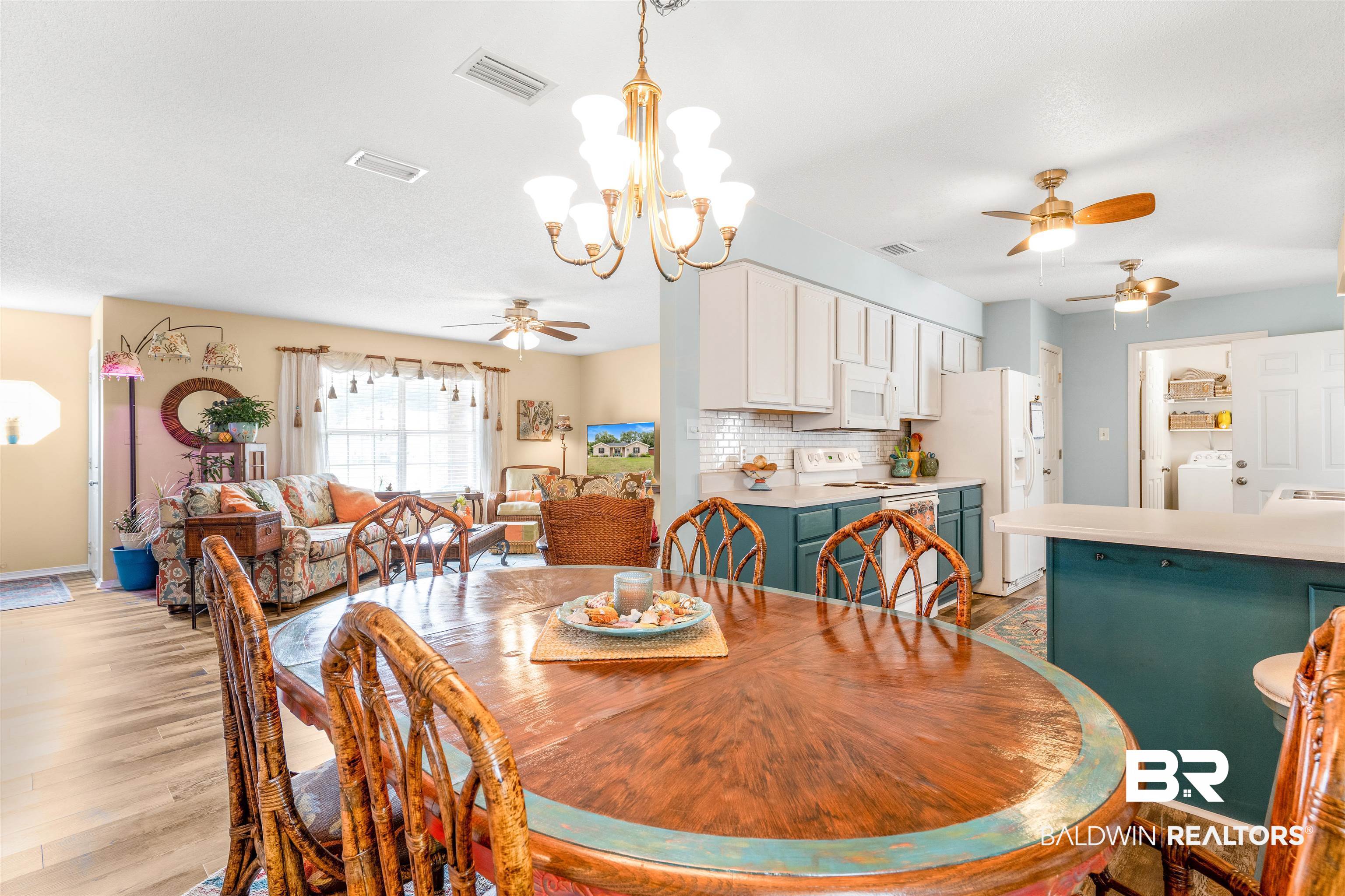 518 Ariel Avenue Foley, AL 36535 - Photo 10 of 47 Dining area featuring light wood-type flooring, ceiling fan with notable chandelier, and washer / clothes dryer