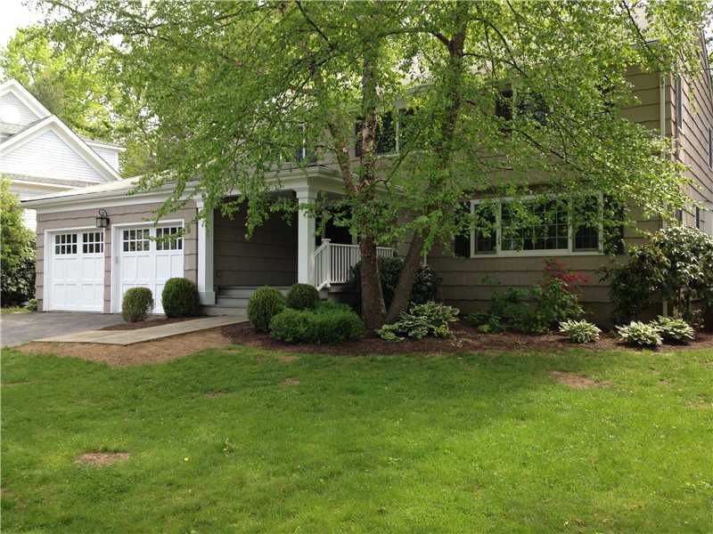 a view of a house with a yard and tree s