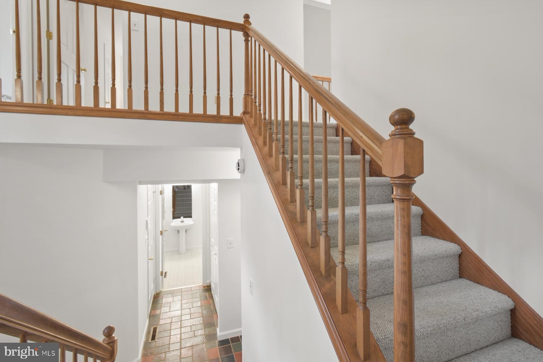 70 Capetown Road Ocean Pines, MD 21811 - Photo 32 of 48 Inviting staircase with warm wood accents.
