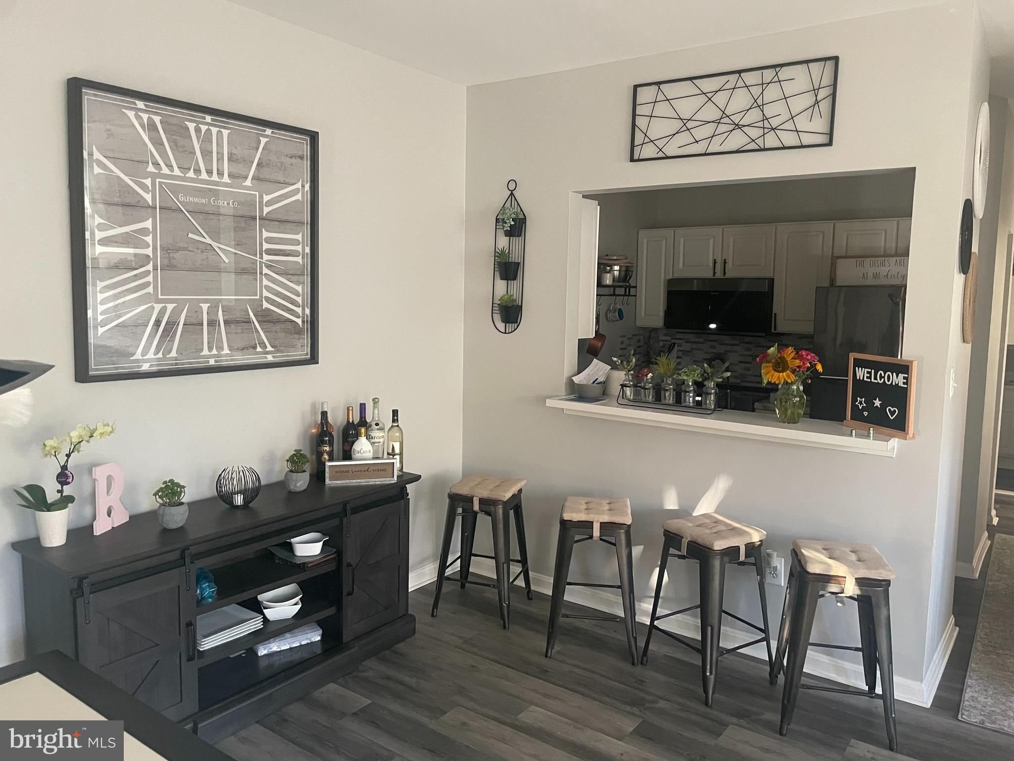 a dining room with furniture and wooden floor