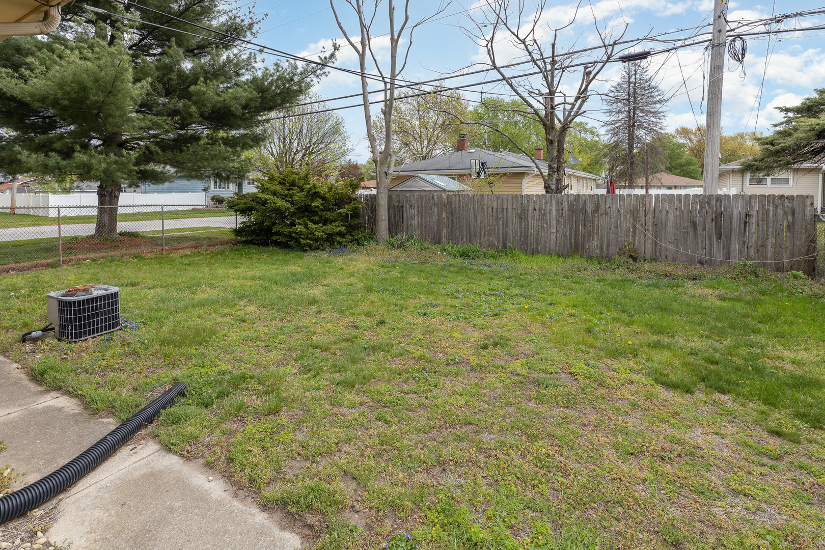 18303 Bock Road Lansing, IL 60438 - Photo 27 of 29 a view of a garden with a bench