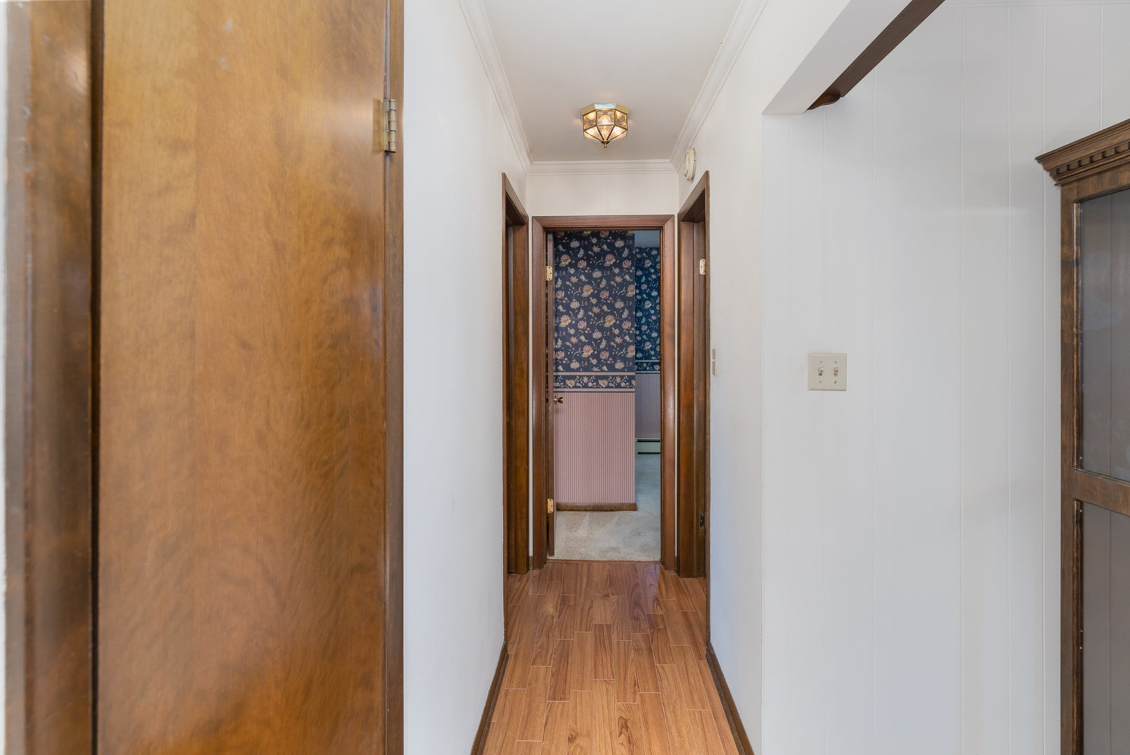 18303 Bock Road Lansing, IL 60438 - Photo 3 of 29 a view of a hallway with wooden floor and entryway