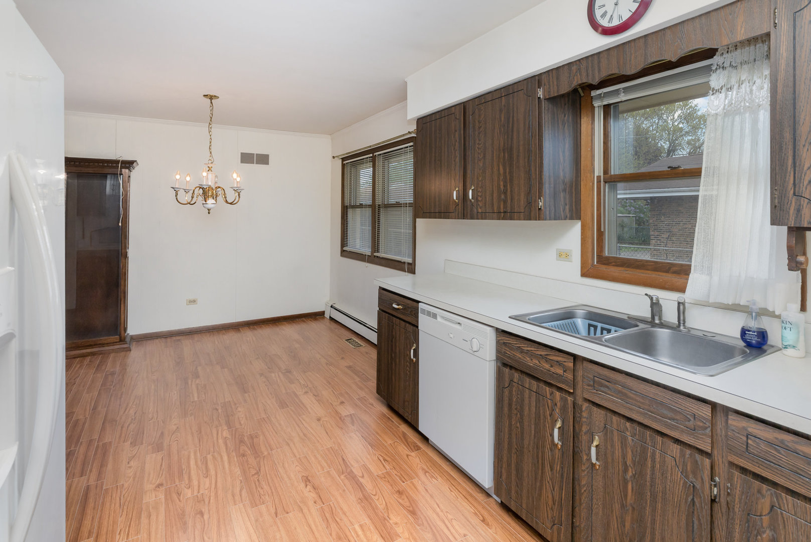 18303 Bock Road Lansing, IL 60438 - Photo 8 of 29 a kitchen with a sink window and cabinets