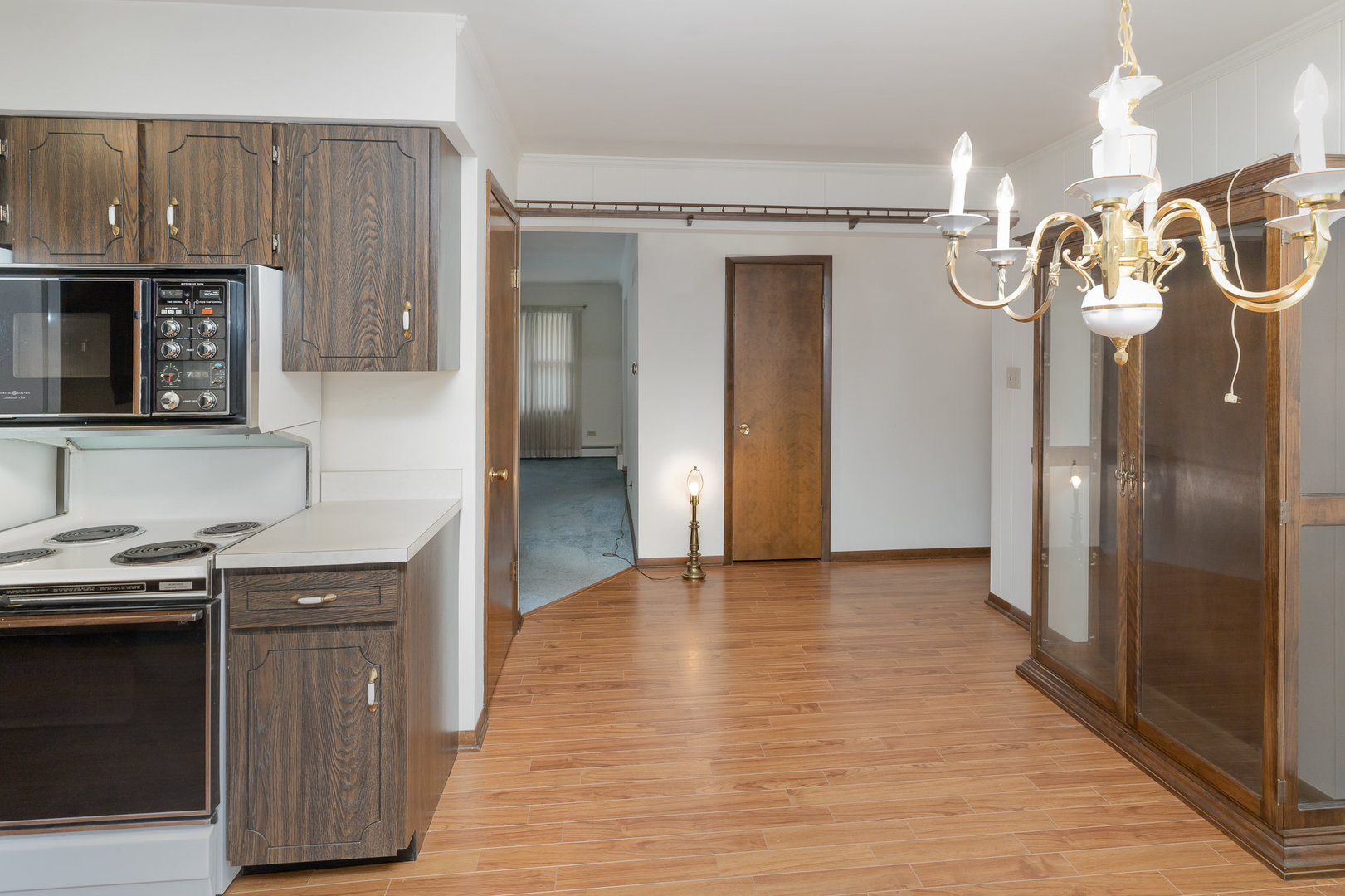 18303 Bock Road Lansing, IL 60438 - Photo 9 of 29 a kitchen with a sink a refrigerator and cabinets