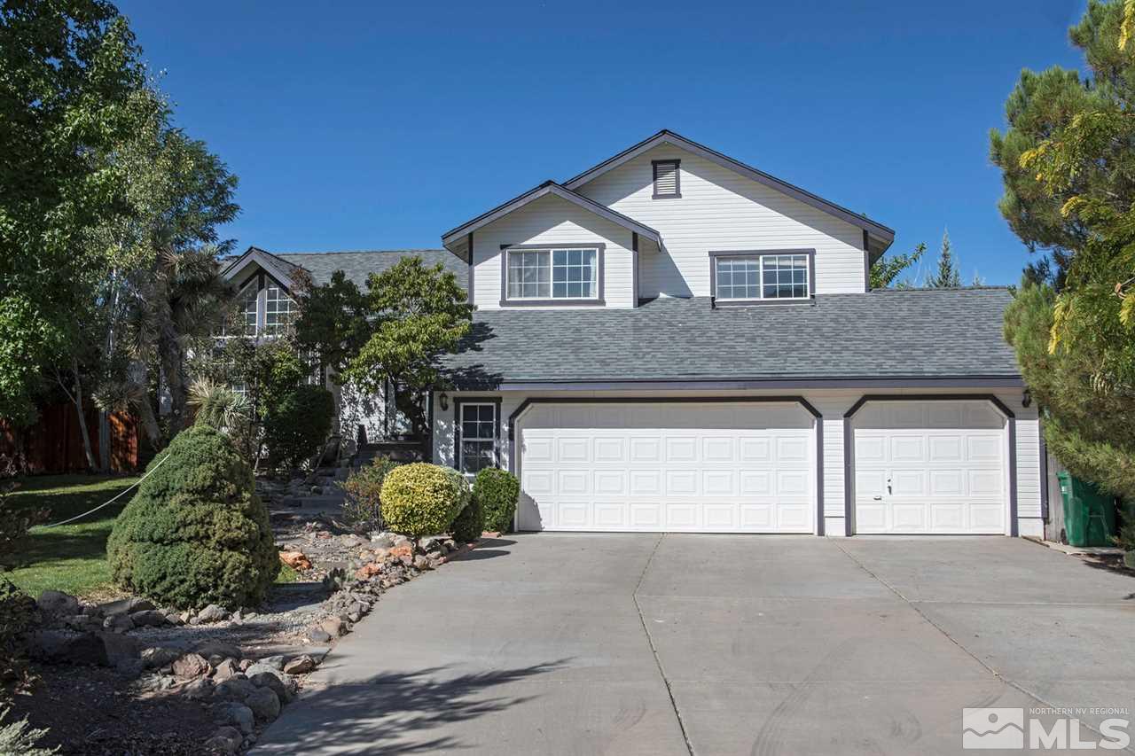 15185 Sylvester Road Reno, NV 89521 - Photo 1 of 25 a front view of a house with garden