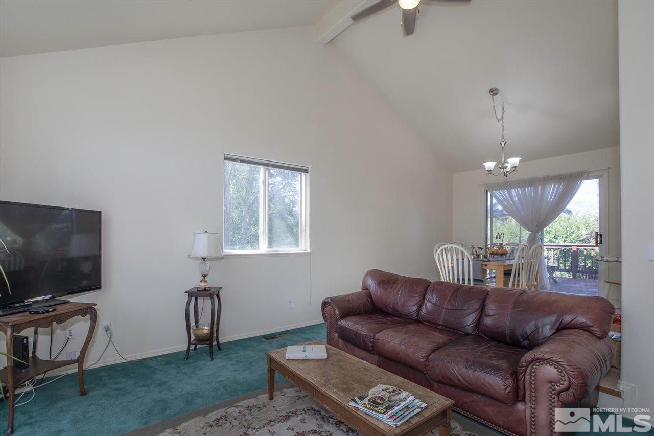 15185 Sylvester Road Reno, NV 89521 - Photo 4 of 25 a living room with furniture and a flat screen tv