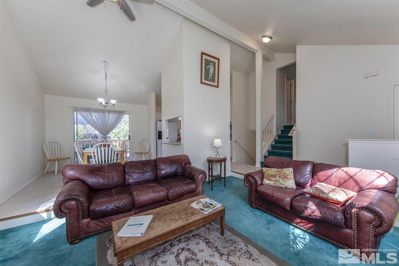 15185 Sylvester Road Reno, NV 89521 - Photo 5 of 25 a living room with furniture and a potted plant
