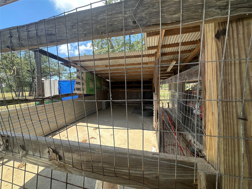 1231 Oak Grove Road Luling, TX 78648 - Photo 25 of 40 a view of empty room with wooden floor and windows