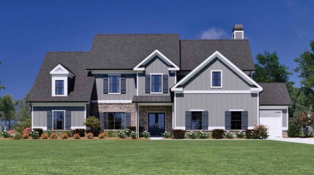 2132 Stonegate Way Monroe, GA 30656 - Photo 1 of 1 a front view of a house with a yard and trees