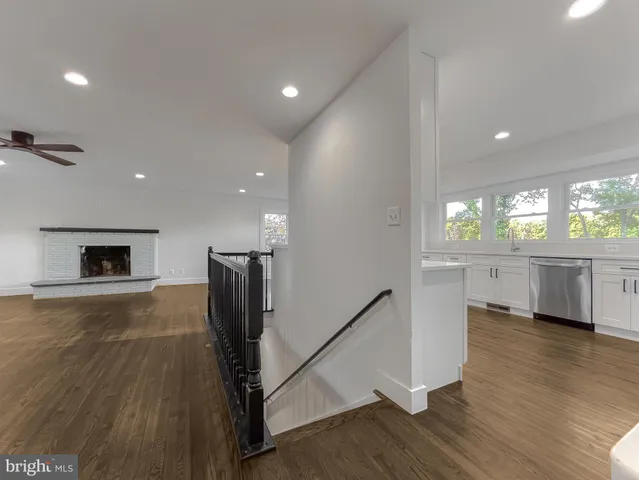 a kitchen with stainless steel appliances granite countertop a sink and a stove top oven