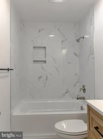 an empty room with a empty space and windows