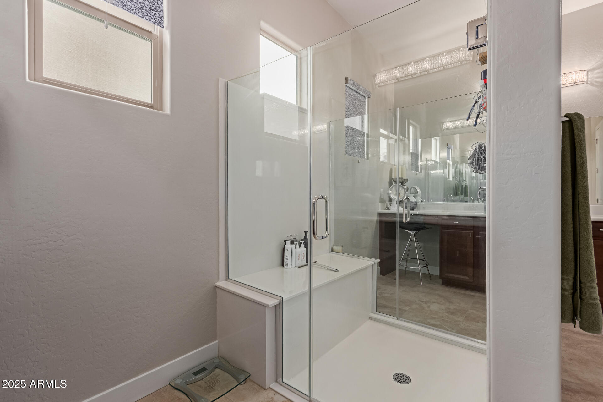 41737 West Cribbage Road Maricopa, AZ 85138 - Photo 22 of 35 a bathroom with a sink a tub and a mirror