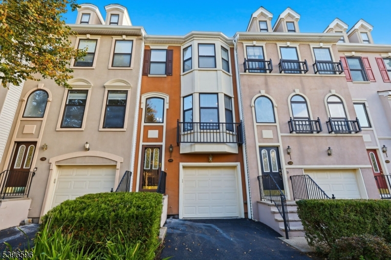 335 Wilshire Drive Nutley, NJ 07110 - Photo 1 of 23 a front view of a residential apartment building with a yard