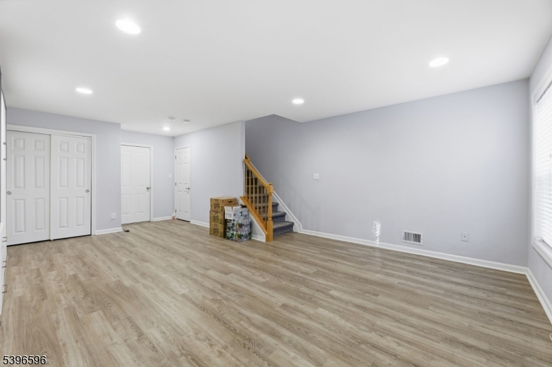 335 Wilshire Drive Nutley, NJ 07110 - Photo 17 of 23 a view of an empty room with wooden floor