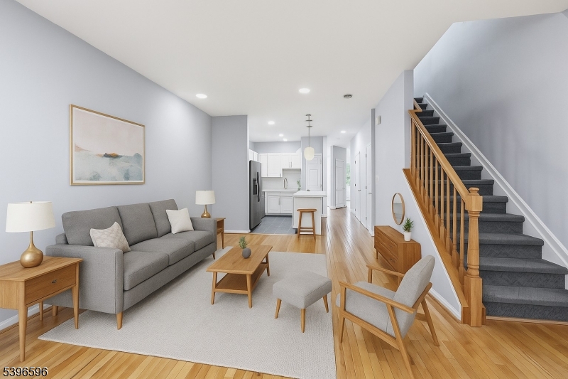335 Wilshire Drive Nutley, NJ 07110 - Photo 5 of 23 a living room with fireplace furniture and a wooden floor