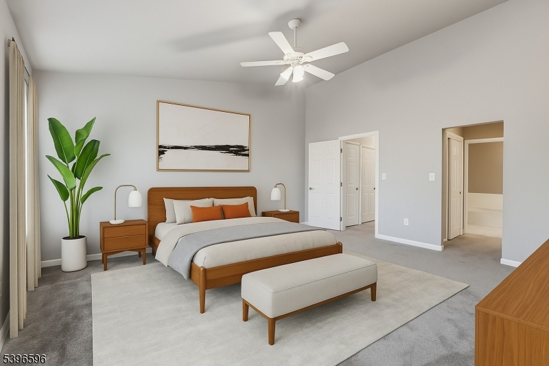 335 Wilshire Drive Nutley, NJ 07110 - Photo 7 of 23 a spacious bedroom with a bed a couch and a potted plant