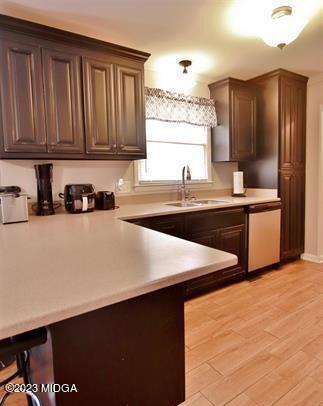 514 Ashby Way Warner Robins, GA 31088 - Photo 13 of 26 a kitchen with stainless steel appliances a sink dishwasher a refrigerator a stove and wooden cabinets