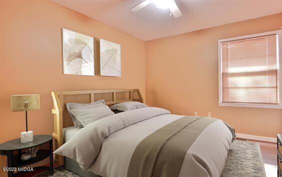 514 Ashby Way Warner Robins, GA 31088 - Photo 18 of 26 a bedroom with a bed and wooden floor