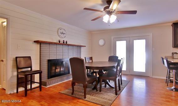 514 Ashby Way Warner Robins, GA 31088 - Photo 4 of 26 a view of a dining room with furniture and wooden floor