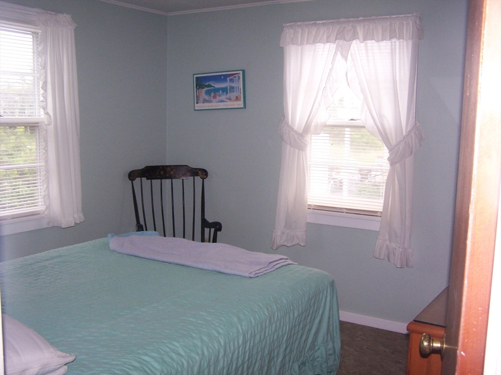 334 Phillips Sagamore Beach, MA 02562 - Photo 4 of 5 a bedroom with a bed and window