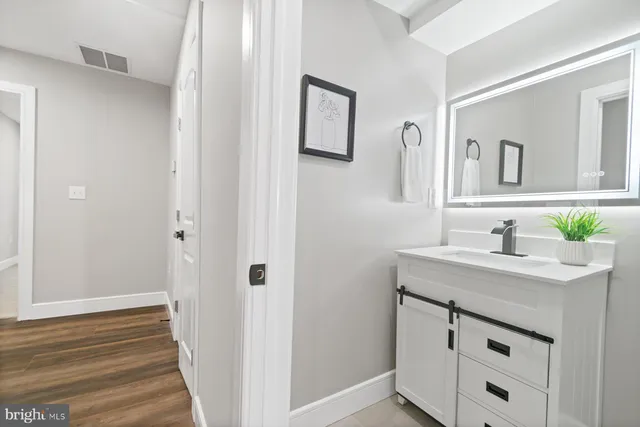 a bathroom with a sink and a mirror