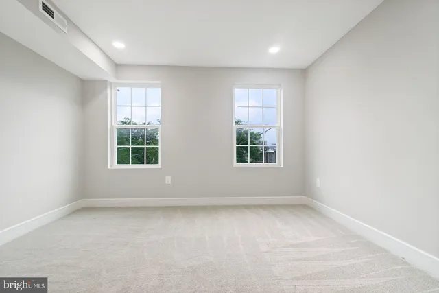 an empty room with windows