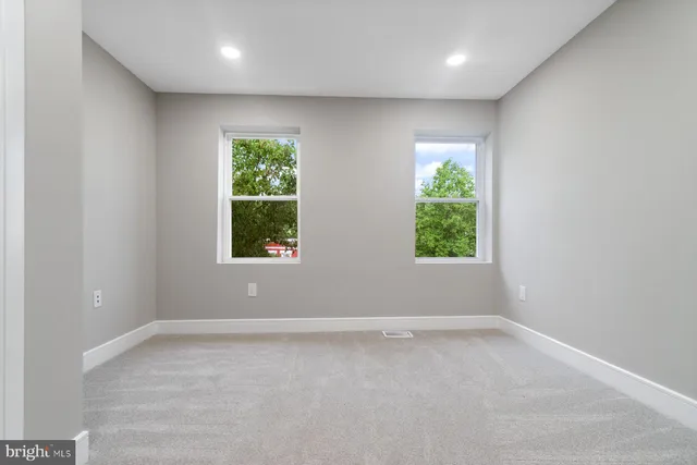 an empty room with a bathroom