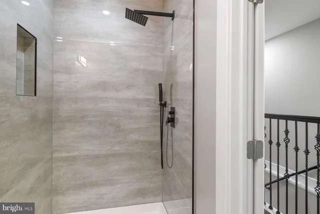 a bedroom with a bed and a mirror