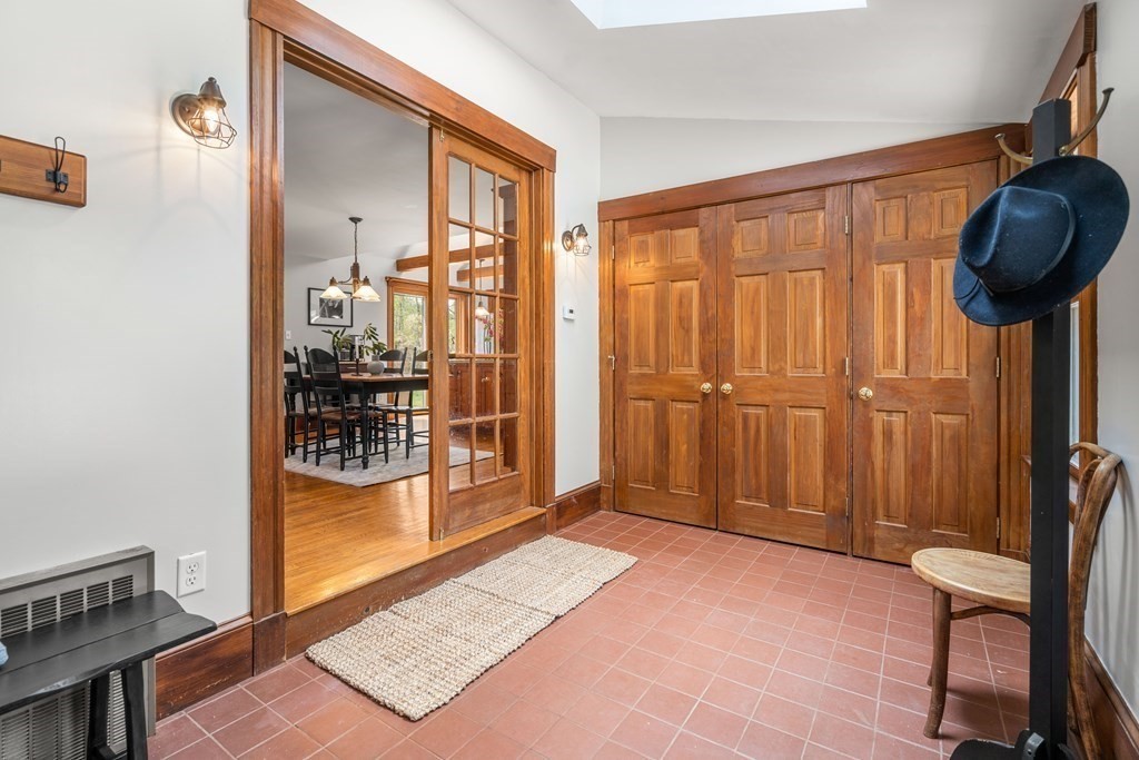 64 Larkin Road Newbury, MA 01922 - Photo 3 of 33 a view of a hallway with furniture and chandelier in a room