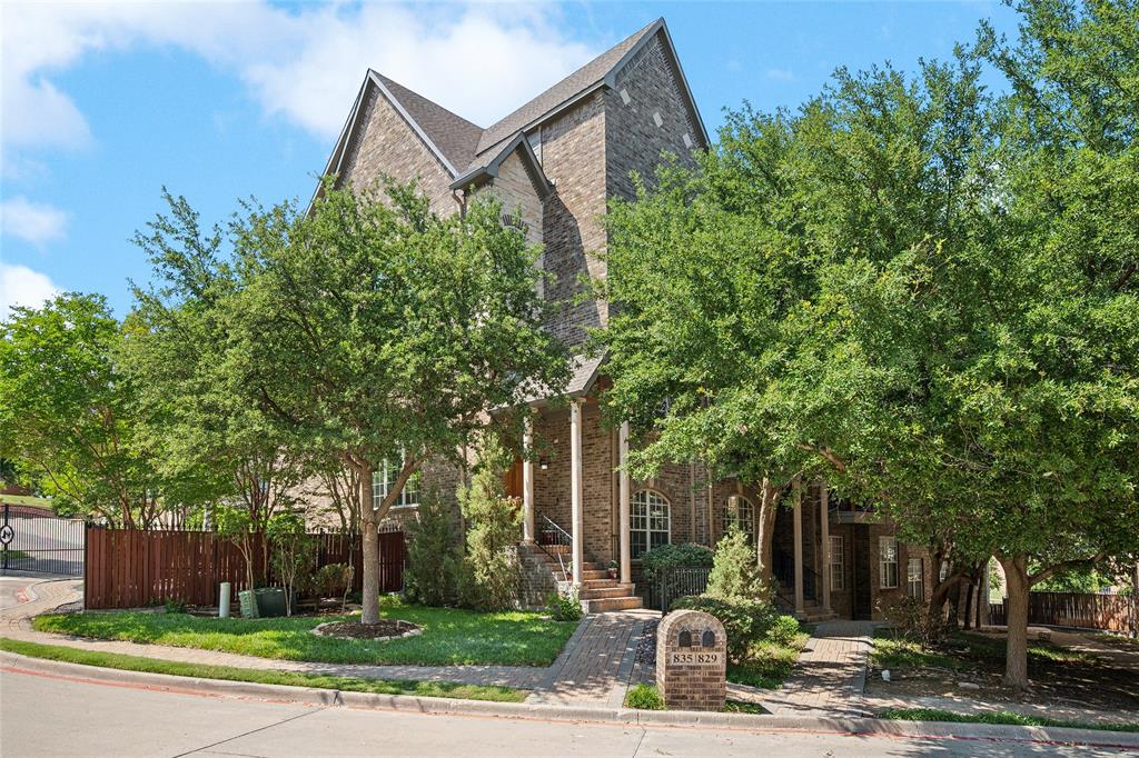 835 Rockingham Drive Irving, TX 75063 - Photo 1 of 27 a front view of a house with garden and trees