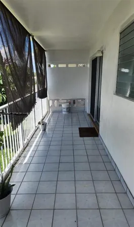 a view of swimming pool from a balcony