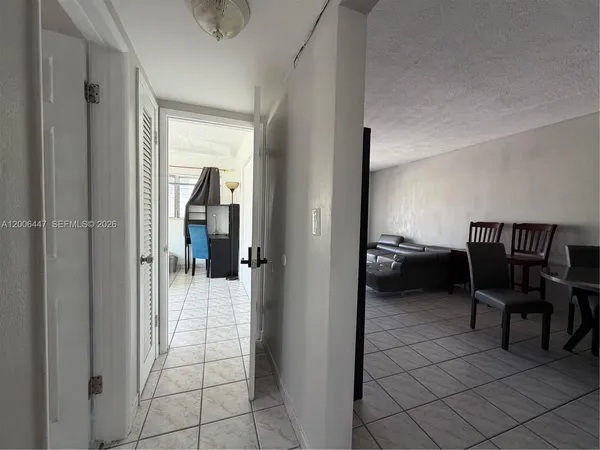a view of a livingroom and a livingroom with furniture