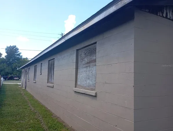 a view of a back yard of the house