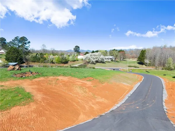 a view of a lake with a yard