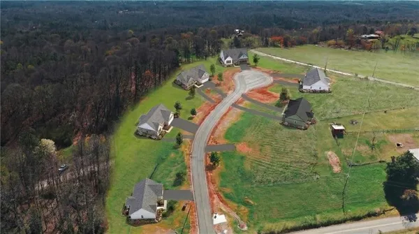 an aerial view of a house with outdoor space