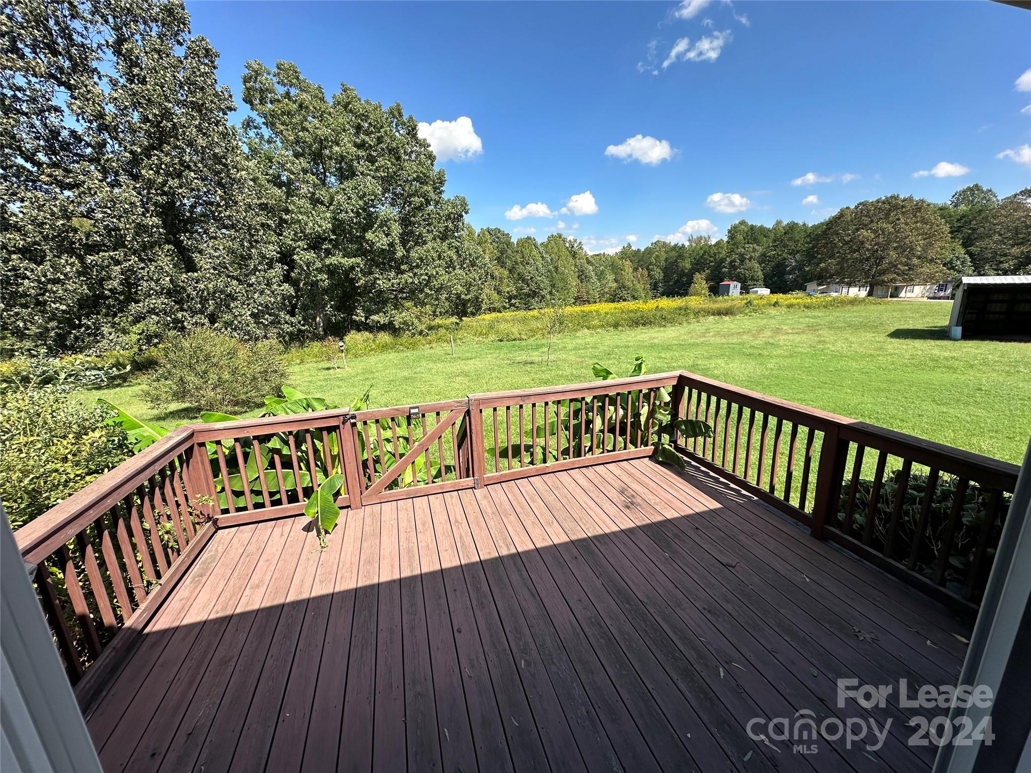 147 Sinclair Road Mooresville, NC 28115 - Photo 9 of 21 a view of balcony with wooden floor and outdoor space